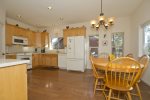Open fully equipped kitchen with seated dining  for 8